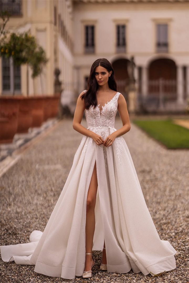 Ivory Lace A-Line Wedding Dress with Sleeveless V-Neck Bodice and Sparkling Train – Embellished Gown with Sheer Skirt and High Slit Plus Size