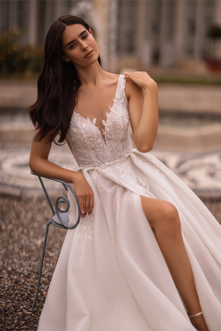 Ivory Lace A-Line Wedding Dress with Sleeveless V-Neck Bodice and Sparkling Train – Embellished Gown with Sheer Skirt and High Slit Plus Size