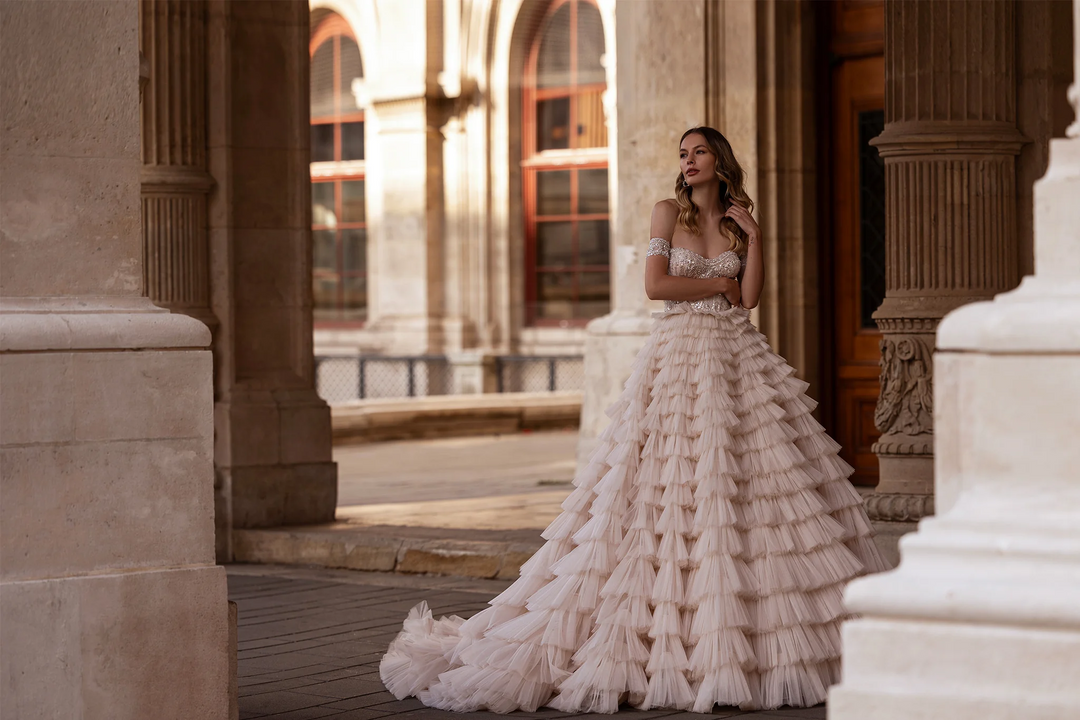 Off Shoulder Wedding Dress with Ruffled Tiered Skirt – Layered Tulle Ruffle Dress with Pearl Trim and Crisscross Back Plus Size