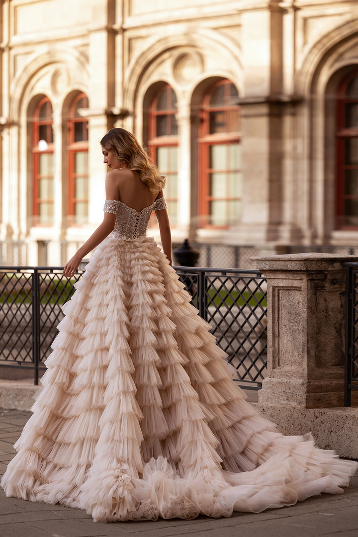 Off Shoulder Wedding Dress with Ruffled Tiered Skirt – Layered Tulle Ruffle Dress with Pearl Trim and Crisscross Back Plus Size
