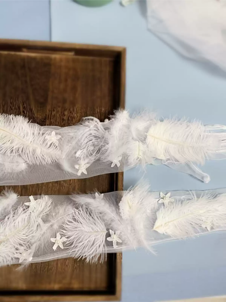 Vintage-Inspired White Feather Bridal Gloves with Star Embellishments