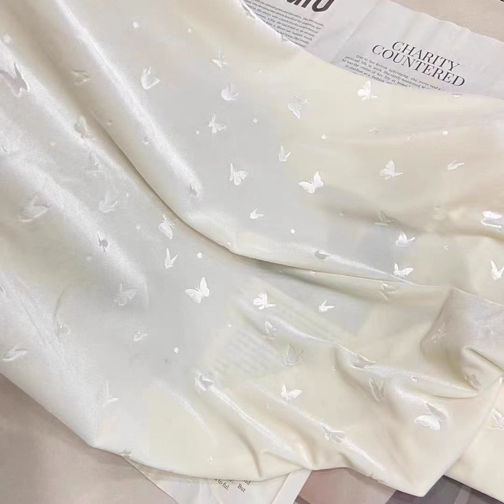 Cream White Velvet Fabric with Embossed Butterflies for Dresses and DIY Projects - WonderlandByLilian