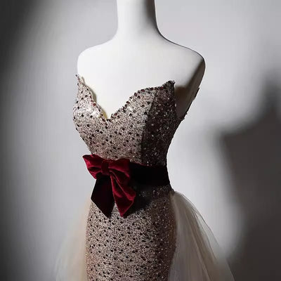 Elegant Champagne Sequined Sheath Gown with Velvet Red Waistband and Tulle Overlay - WonderlandByLilian