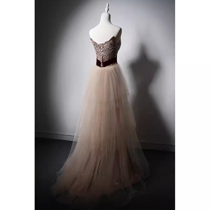 Elegant Champagne Sequined Sheath Gown with Velvet Red Waistband and Tulle Overlay - WonderlandByLilian