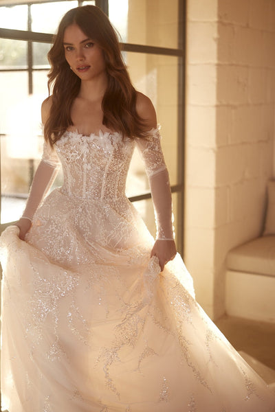 Enchanting Corseted A-Line Bridal Gown with Translucent Sleeves and Embellished Skirt Plus Size - WonderlandByLilian