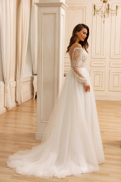 Ethereal Off-Shoulder Sequin Bridal Gown with Pearl Embellishments and Long Sheer Sleeves Plus Size - WonderlandByLilian