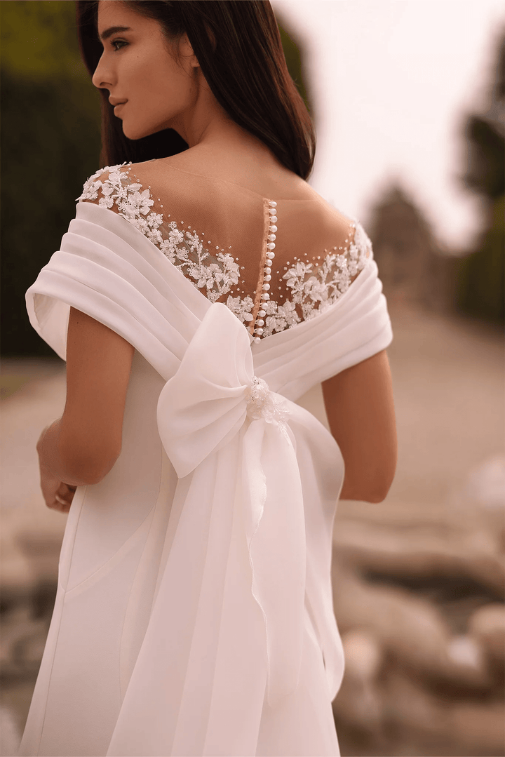 Ivory Off - the - Shoulder Wedding Dress with Thigh Slit – Trumpet Gown with Flower Adorned Neckline and Cascading Bow Plus Size - WonderlandByLilian