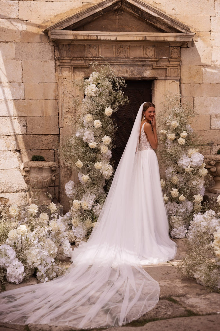 Ivory Tulle Bridal Gown with Luxurious Sequined Train and Plunging Neckline Plus Size - WonderlandByLilian