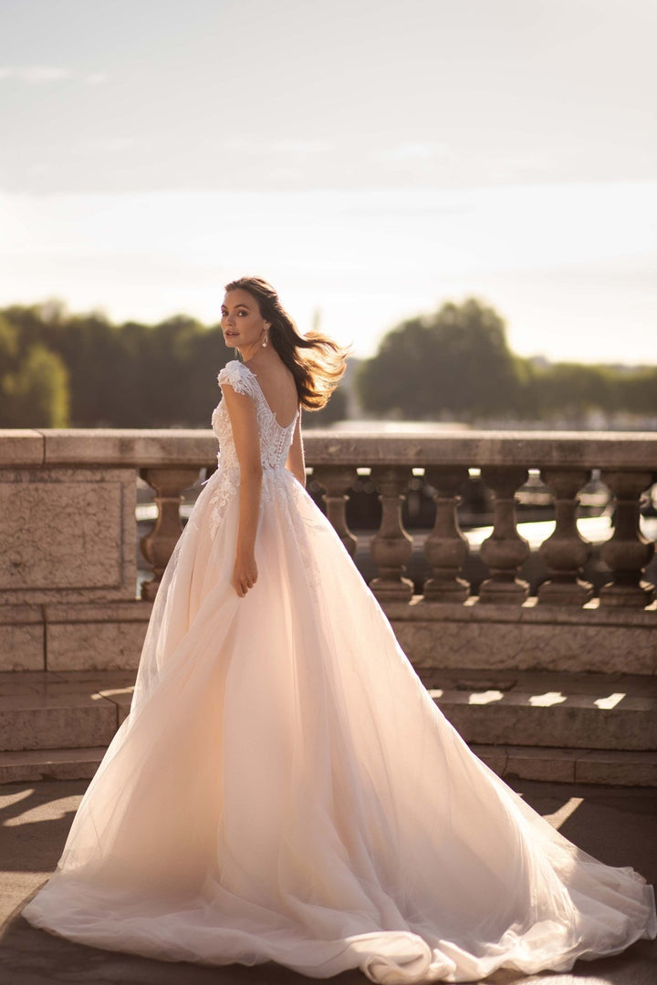 Nude Wedding Dress with Long Sheer Sleeves, 3D Floral Appliqués, and Voluminous Glitter Tulle Skirt Plus Size - WonderlandByLilian