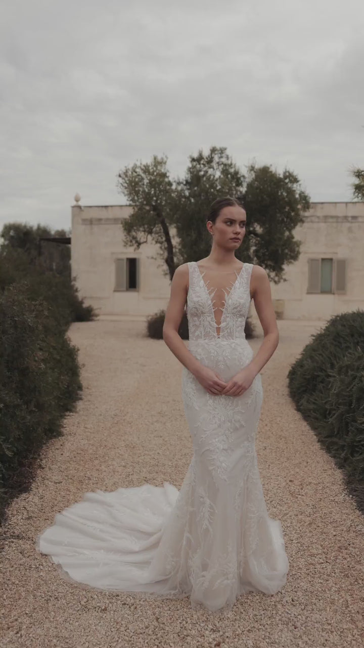 Elegant Lace Mermaid Wedding Gown with Deep V-Neck and Luxurious Train Plus Size