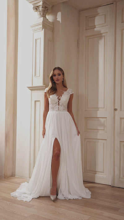 Sophisticated A-Line Wedding Dress with Lace Embellishments and Sheer Overlay Train
